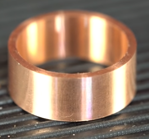 Customized cool ring made out of superconductor and 18k rose gold