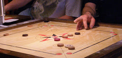 Carrom and Crokinole