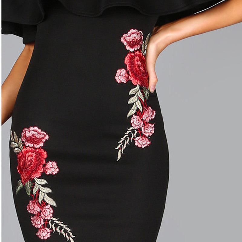black dress with embroidered roses