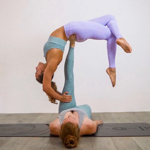 Yoga. Two young women practicing yoga poses. Stock Photo | Adobe Stock