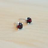 4 prong Argentium Silver post earrings for sensitive ears with facet cut garnet gemstones