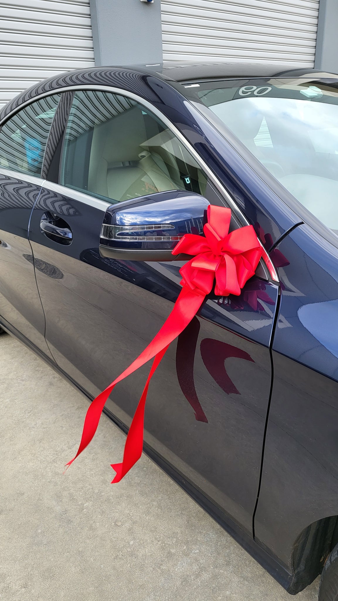 red opening bow wedding car ribbon