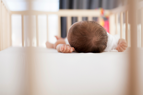 Baby sleeping on a all memory foam baby mattress in Malaysia