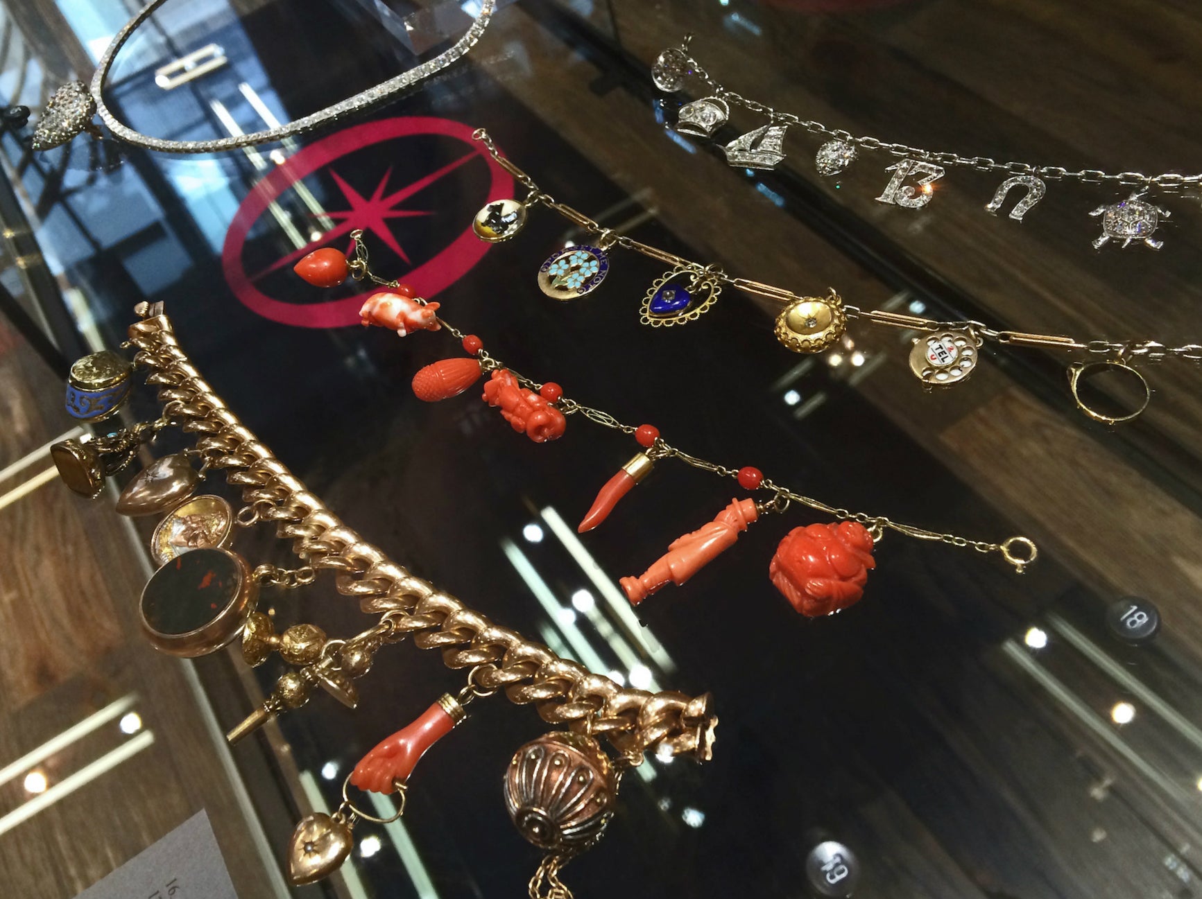 Vintage and antique charm bracelets on display at Beth Bernstein's book launch, hosted by Doyle & Doyle.