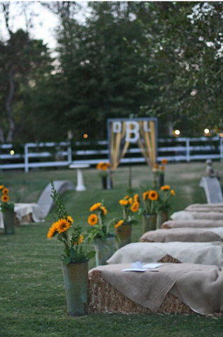 hay bale seating at wedding ceremony 