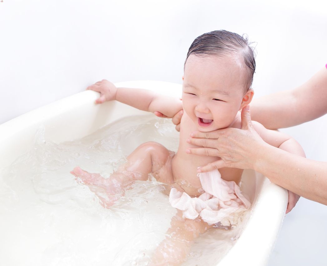 Baby enjoying a lavender oil bath before bedtime. 