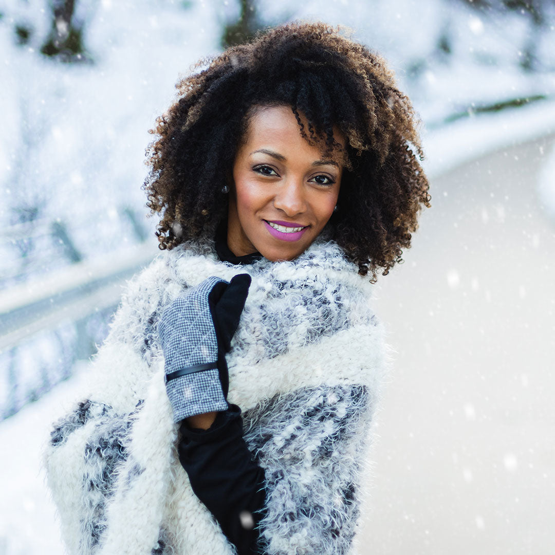 Cheerful-stylish-afro-hair-woman-wearing-warm-clothes-and-gloves