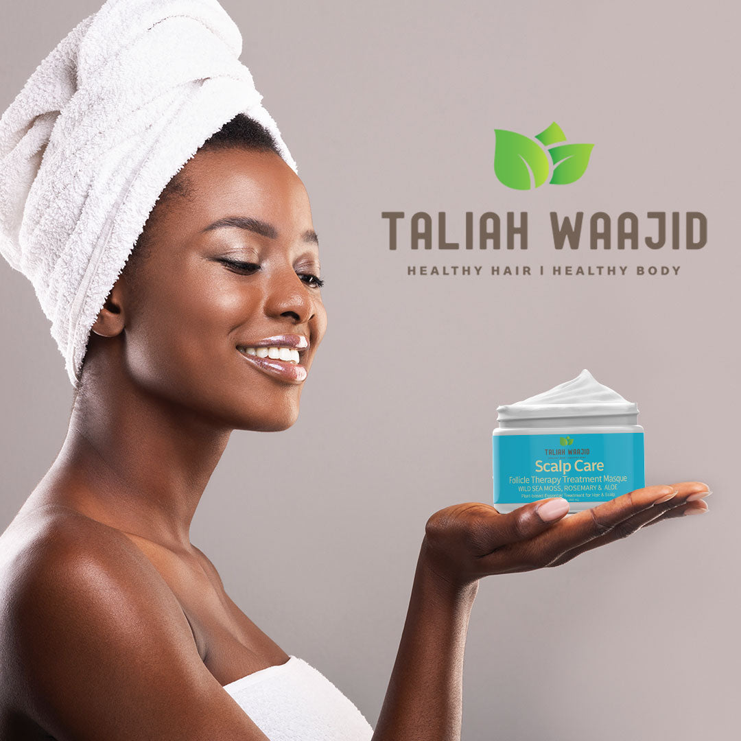 Smiling-african-american-woman-holding-jar-of-Taliah-Waajid-Scalp-Care-Masque-on-open-palm
