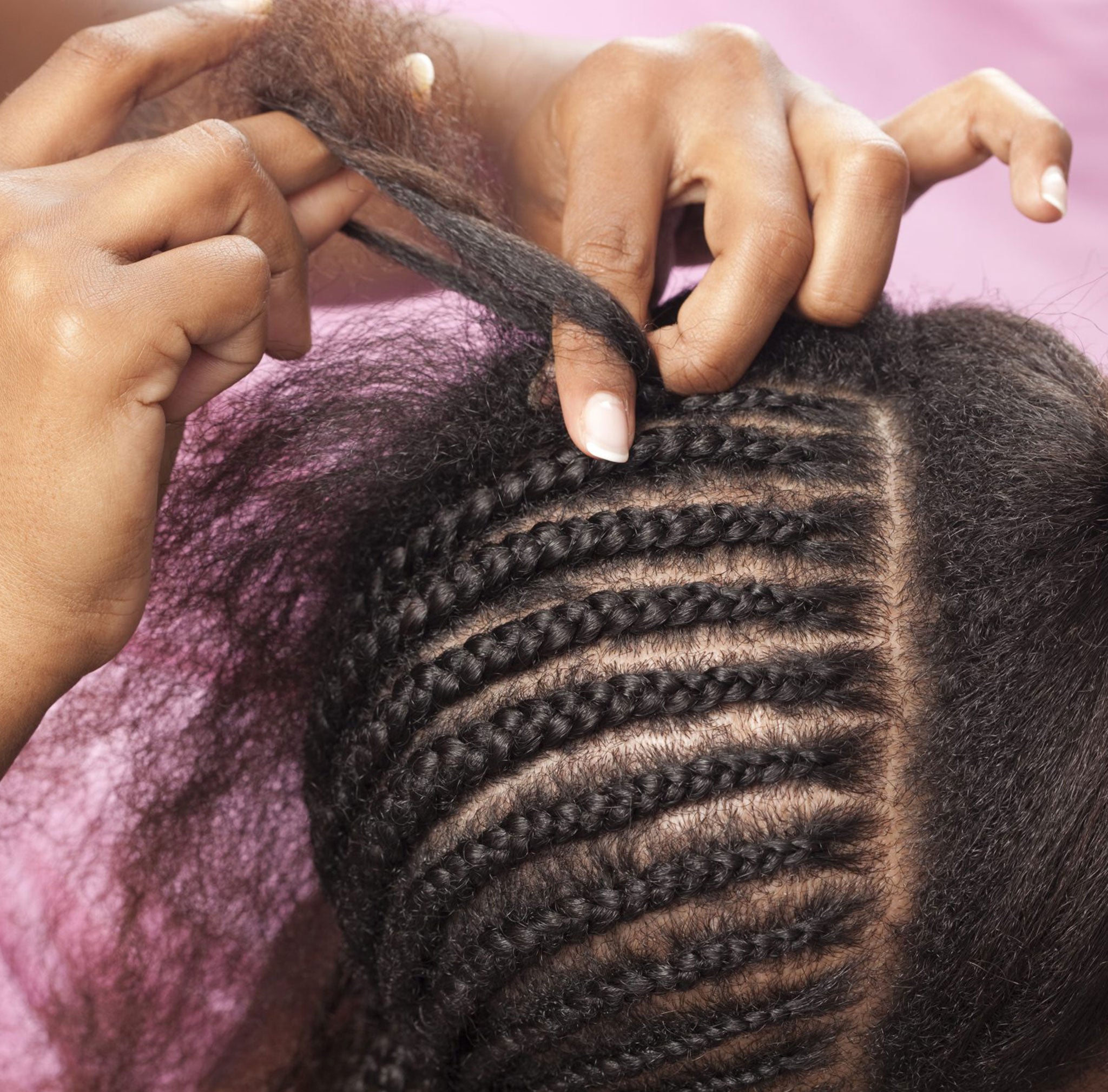 Woman Working On Braids