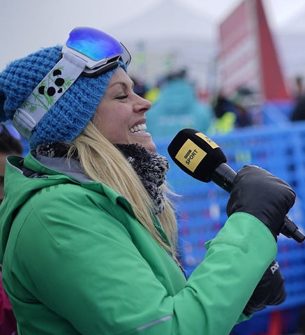Ski commentator and Olympic champion wears PANDA Optics Goggles while interviewing at a ski event