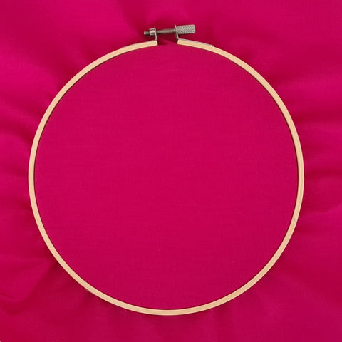 Close up photo of fabric inside an embroidery working hoop