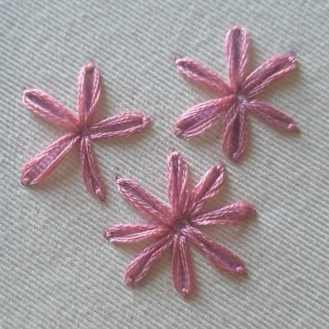 Photo of three Lazy daisy stitches as examples