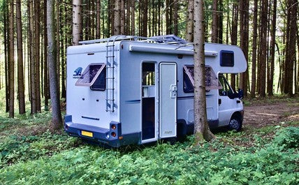 Camper van with bed lift