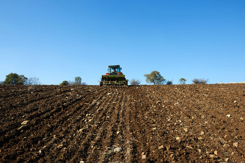 Photo of a tractor working in the field 