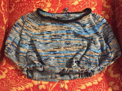Yoke of a partially knit variegated sweater