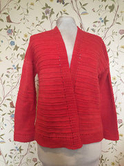 coral colored cardigan "Holey Comfort"