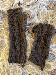 two brown Abington Mitts with cabling, almost finished