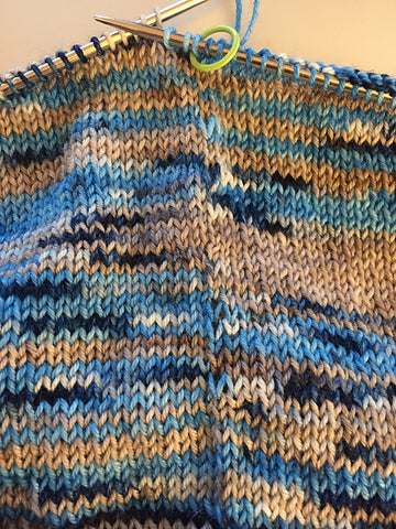the place on a sweater where two skeins are being alternated