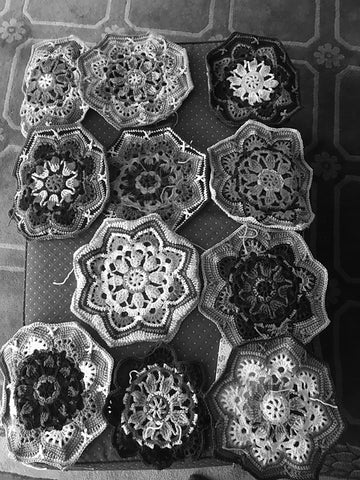 the same photo of crocheted motifs in black and white