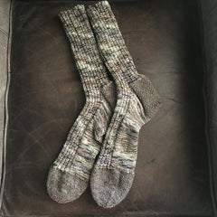 green and gray variegated socks with gray heel and toes