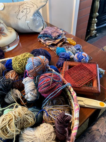basket of yarn scraps and pin loom