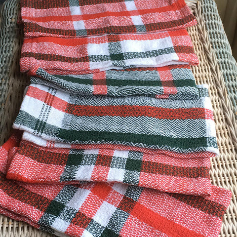 red and green handwoven dishtowels