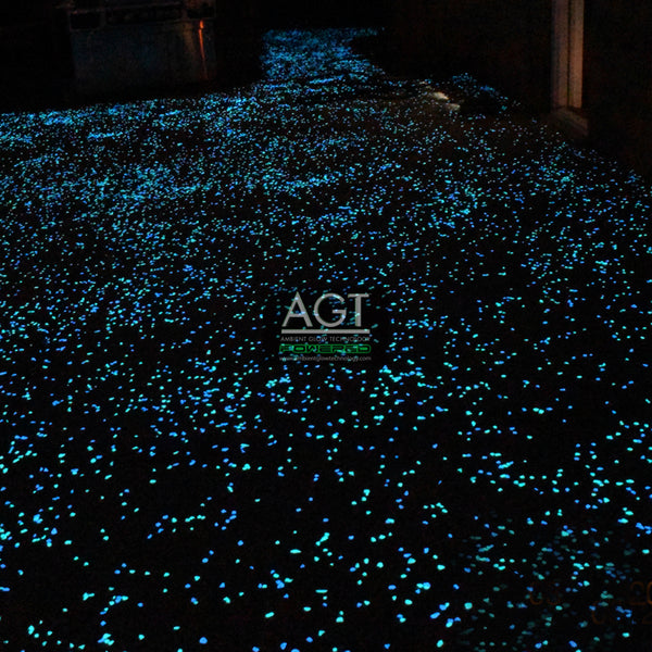 Glow in the dark concrete patio and walkway powered by 1/2" AGT™ Ultra Glow Stones in Aqua Blue & Emerald Yellow