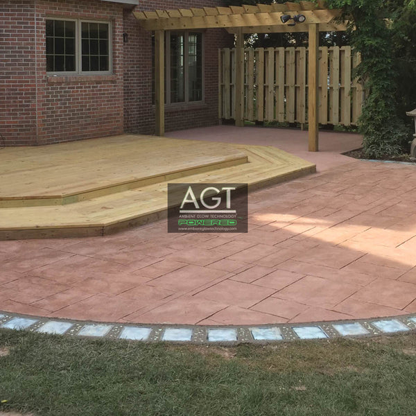 Day time view of glowing patio stones powered by AGT™ Sky Blue Fine Glow Sand.