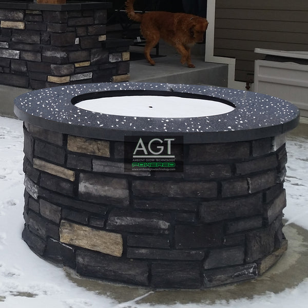Glowing concrete fire pit surround powered by AGT™ 1/2" Commercial Grade Glow Stones.