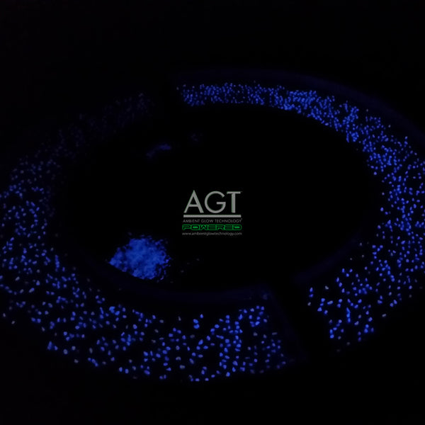 Night time view of glowing concrete fire pit surround powered by AGT™ 1/2" Commercial Grade Glow Stones.