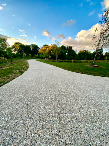 Glowing exposed aggregate concrete surface creating a beautiful glowing trail