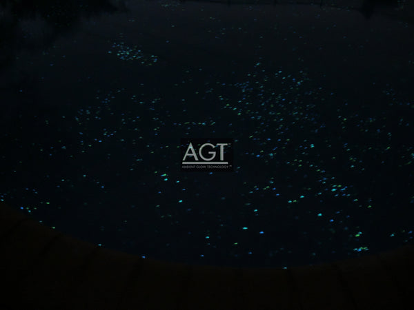 Glowing pool plaster interior Powered by 1/2" Emerald Yellow AGT™ ULTRA Glow Stone. Night time view.