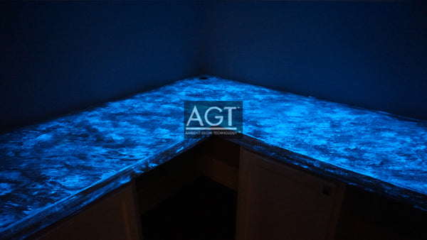 Glowing concrete countertop, powered by AGT™ Sky Blue Glow Sand. Glow in the dark fine sand was placed in the concrete sealer and then applied.