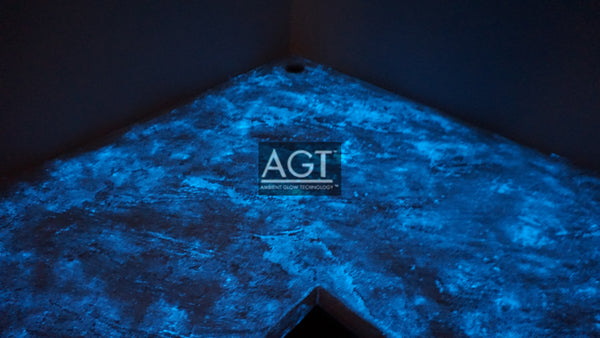 Glowing concrete countertop, powered by AGT™ Sky Blue Glow Sand. Glow in the dark fine sand was placed in the concrete sealer and then applied. Close up angle