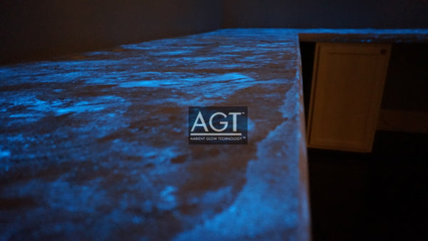 Glowing concrete countertop, powered by AGT™ Sky Blue Glow Sand. Glow in the dark fine sand was placed in the concrete sealer and then applied. Table View