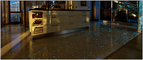 White polished concrete kitchen floor powered by ½” Aqua Blue Glow Stones during the night.