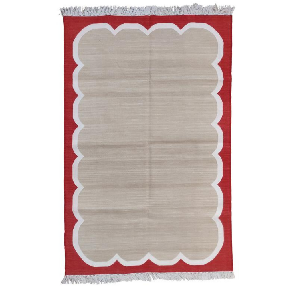 Scalloped red flat weave rug