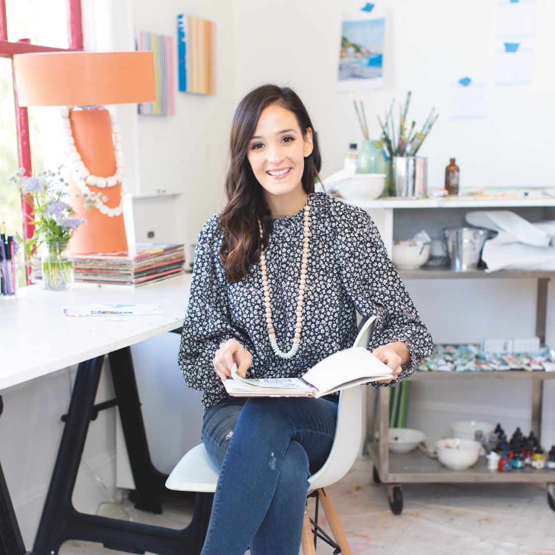 Brunette woman holding open book in studio