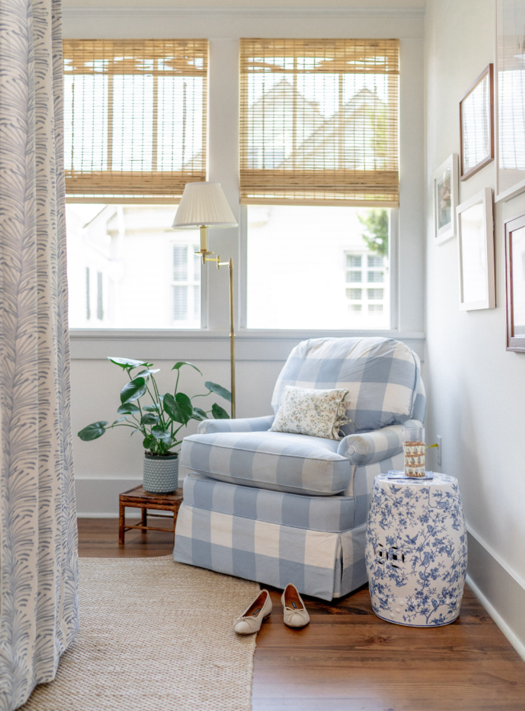 Room corner with a blue plaid sofa chair next to a tall lamp, a plant in a claypot, and two illuminated windows by a Sky Blue Botanical Stripe Custom Curtain