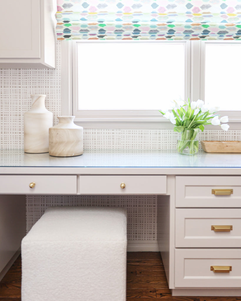 Office desk close-up styled with plaid beige custom wallpaper