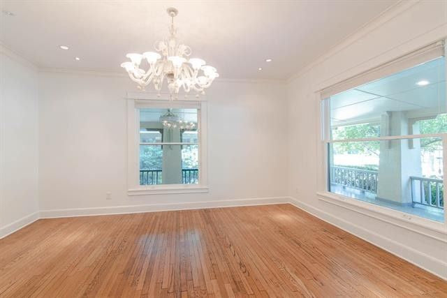 Empty room with white walls and wooden floors
