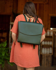 woman wearing green backpack 