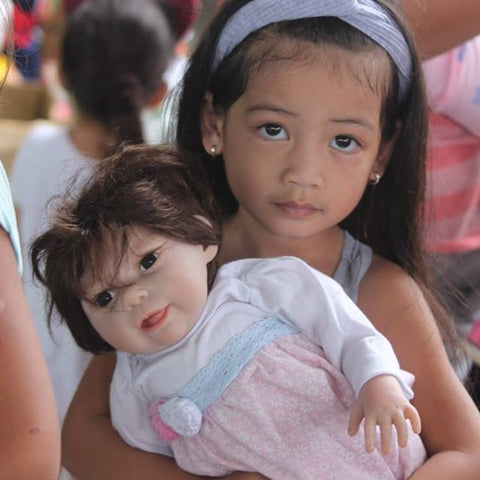 Charisma Brands donates hundreds of dolls to children in the Philippines