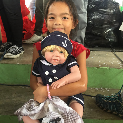 Charisma Brands donates hundreds of dolls to children in the Philippines