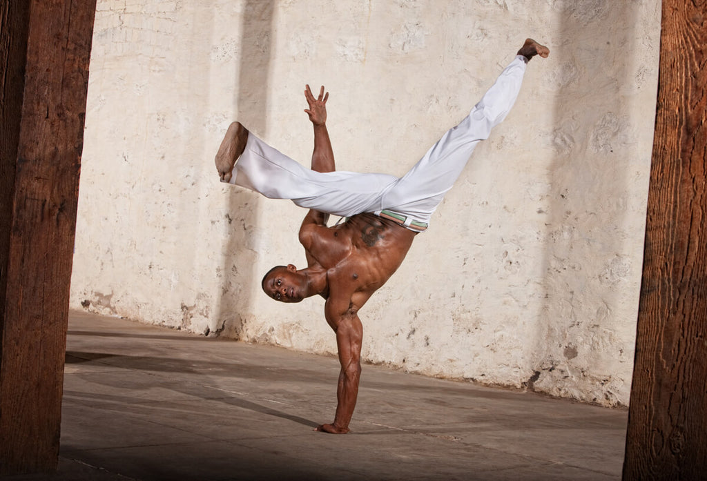 Afro Brazillian displaying capoeira