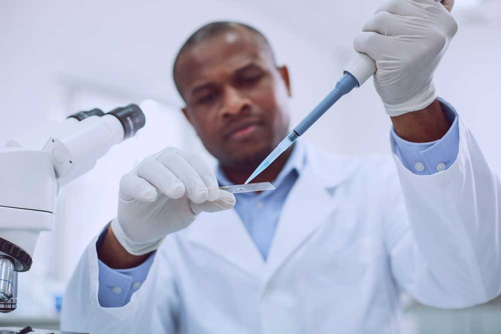 Image of an African American scientist doing DNA research