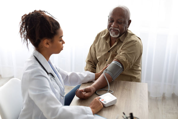 African American man getting a health checkup before traveling to Africa.