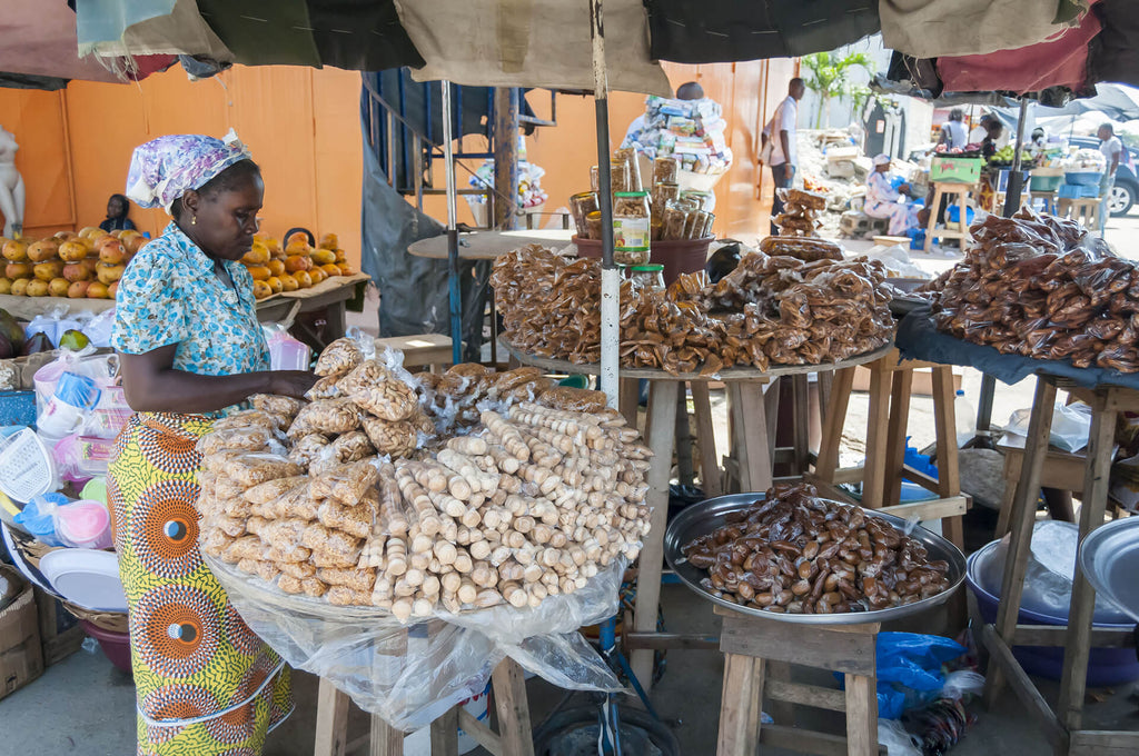 Woman selling at the Sierra Leone food market.