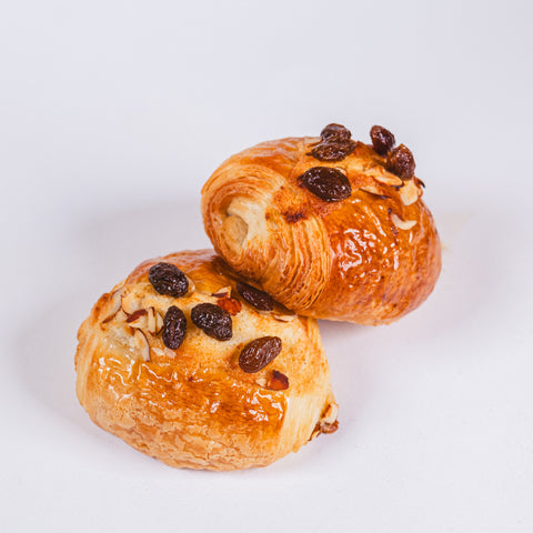Frozen to oven rum and raisin croissants for the best experience at home. Yann Haute Patisserie, authentic French pastry shop offering macarons, cakes, bread, croissants in our yellow house with parking at the back!