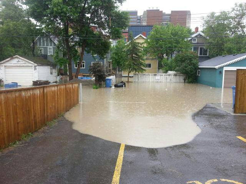Picture of the waters rising dangerously close to the house during the 2013 flood in Calgary.